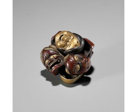 A LACQUER NETSUKE OF A CLUSTER OF MASKSUnsignedJapan, 19th centuryFinely carved and lacquered in gold, silver and red maki-e,