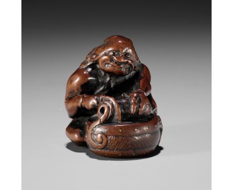 GYOKUMIN: A FINE AND RARE NAGOYA SCHOOL WOOD NETSUKE OF RAIJIN CUTTING A CUCUMBERBy Gyokumin, signed Gyokumin 玉珉 and kakihanJ