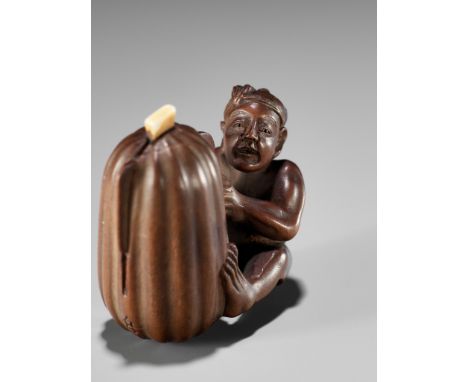 SHUGETSU SHIZAN: A FINE WOOD NETSUKE OF A MAN CUTTING A GIGANTIC GOURDBy Shugetsu, signed Shugetsu 舟月 with seal Shizan 紫山Japa