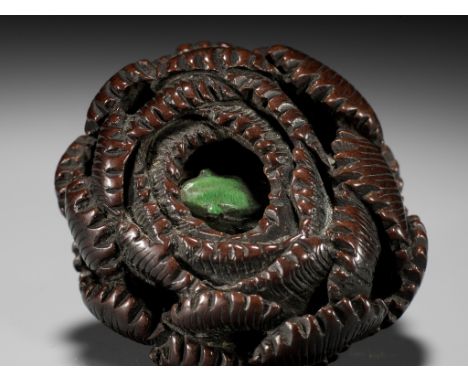 A RARE TOKYO SCHOOL COROZO NUT AND STAG ANTLER NETSUKE OF A FROG INSIDE A CHRYSANTHEMUMUnsignedJapan, Edo (Tokyo), mid to lat