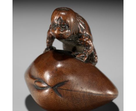 SUKETADA: A FINE WOOD NETSUKE OF A KAPPA TRAPPED BY A CLAMBy Suketada, signed Suketada 亮忠Japan, Takayama, Hida Province, earl