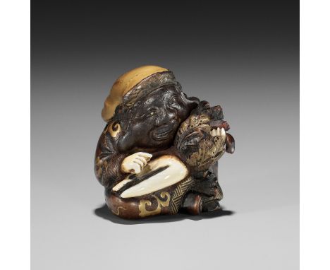 A RARE AND UNUSUAL INLAID AND LACQUERED WOOD NETSUKE OF DAIKOKUUnsignedJapan, 19th centuryDepicting the lucky god seated, hol