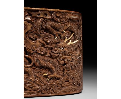 A LARGE AND FINE INLAID AND CARVED WOOD TONKOTSU WITH DRAGON, TIGER AND SHISHIUnsigned Japan, late 19th centuryFinely carved 