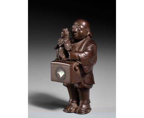 SOZAN: A VERY FINE SO SCHOOL WOOD NETSUKE OF A PUPPETEERBy Sozan, signed Sozan 宗山Japan, Tokyo, late 19th to early 20th centur