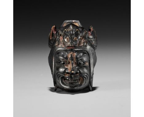 TESSAI: A RARE LACQUERED WOOD GIGAKU MASK NETSUKEBy Kano Tessai (1845-1925), signed signed Tessai 銕哉 to 刀 with kakihan Japan,