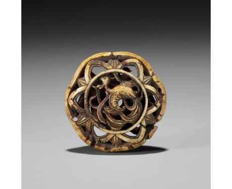 A STAG ANTLER RYUSA MANJU NETSUKE OF A HO-O BIRD AND UNUSUAL MONUnsignedJapan, Tokyo, Asakusa, mid to late 19th centuryFinely