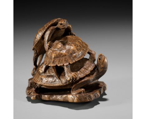 A WOOD OKIMONO NETSUKE OF A TURTLE PILE ON A ROOF TILE, ATTRIBUTED TO TADAKAZUAttributed to Tadakazu (Chuichi), unsignedJapan