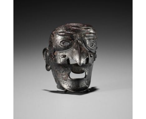 A RARE LACQUERED IRON MASK NETSUKE DEPICTING A TENGU SOMENUnsigned Japan, 19th centuryPublished: Rutherston, Max (2017) Japan