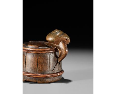 SHIGEMASA: A FINE WOOD NETSUKE OF A SNAIL ON BUCKETBy Shigemasa, signed Shigemasa 重正 and kakihanJapan, Nagoya, mid-19th centu