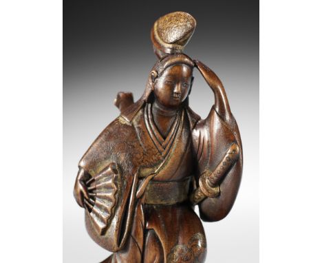 A MASTERFUL AND VERY RARE LACQUERED WOOD NETSUKE OF IZUMO NO OKUNIUnsignedJapan, 18th century, Edo period (1615-1868)Publishe