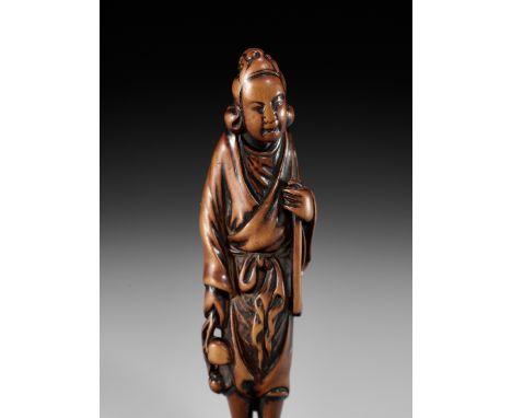 A SUPERB TALL WOOD NETSUKE OF SEIOBOUnsignedJapan, 18th century, Edo period (1615-1868)The Queen Mother of the West standing 