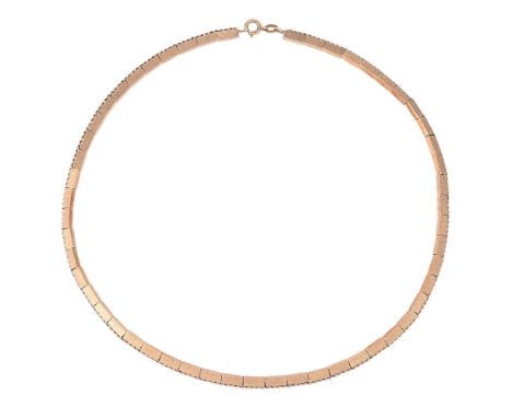 
	
		A 14 CARAT GOLD BRICK LINK NECKLACE 
		LONDON 1961 IMPORT MARK
		The textured and polished brick links on a rope twist c