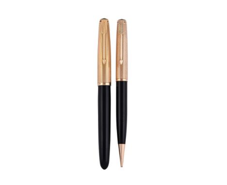 
	
		PARKER, V.S., MARK I 
		A FRENCH GOLD COLOURED AND BLACK RESIN FOUNTAIN PEN AND PENCIL 
		CIRCA 1946
		Cap and Barrel: W
