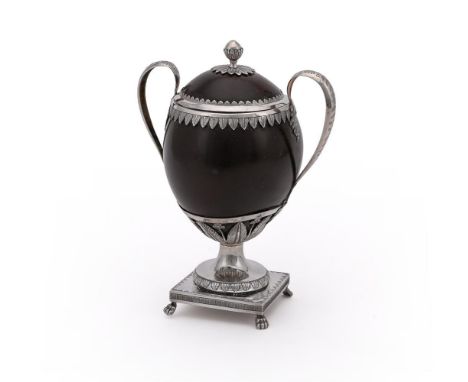 
	
		A SILVER MOUNTED COCONUT CUP AND COVER
		18TH CENTURY, FRENCH IMPORT MARK OF UNKNOWN ORIGIN
		With a bud finial to the d