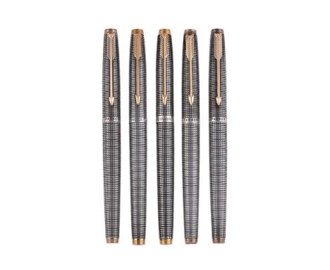 
	
		PARKER, 75, CISELÉ 
		FIVE SILVER COLOURED FOUNTAIN PENS
		Cap and Barrel: With chiselled silver coloured caps and barre