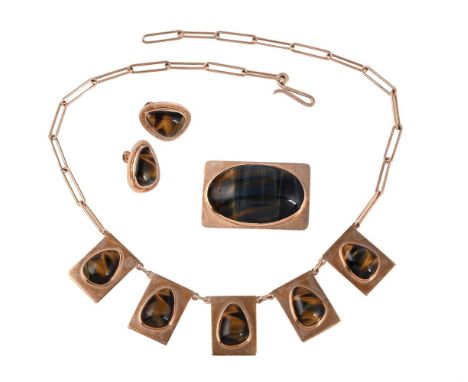 
	
		HAGLUND, A 1970S SOUTH AFRICAN HAWKS EYE/TIGERS EYE NECKLACE, BROOCH AND EARRING SUITE
		The rectangular polished panels