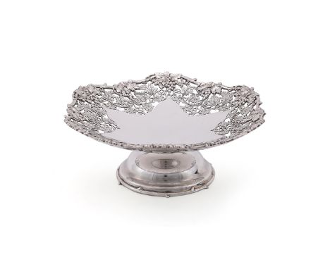 
	
		A SILVER PIERCED PEDESTAL DISH
		ASPREY &amp; CO. LTD., LONDON 1935
		With a chased and pierced grape vine border and bo