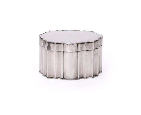 AN INDIAN SILVER SHAPED OVAL BISCUIT TIN HAMILTON &amp; CO. LTD., CALCUTTA CIRCA 1920 With beaded borders and engraved with a