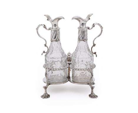 
	
		A GEORGE III SILVER OIL AND VINEGAR CRUET STAND
		MAKER'S MARK OBSCURED, POSSIBLY R.P, LONDON 1770
		With a beaded doubl