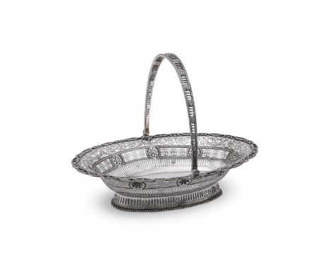 A GEORGE III SILVER OVAL SWING HANDLED BASKET WILLIAM PLUMMER, LONDON 1782 The oval beaded swing handle with flower head roun