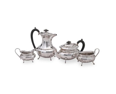 
	
		A SILVER OVAL BALUSTER FOUR PIECE TEA SET
		VINER'S LTD., SHEFFIELD 1939
		The tea pot and hot water pot with wooden ova