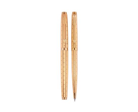 
	
		PARKER, 75  
		PERLÉ, A GILT FOUNTAIN PEN AND PENCIL
		Cap and Barrel: With striated and spotted gilt caps and barrels, 