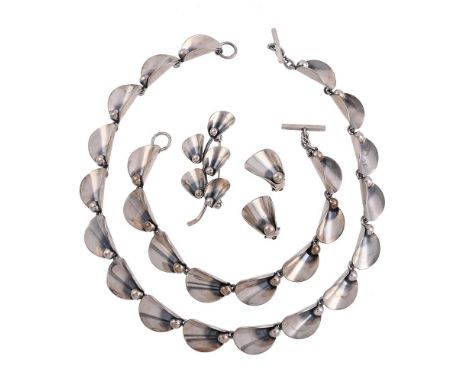 
	
		NIELS ERIK FROM, A SMALL COLLECTION OF VINTAGE SILVER COLOURED JEWELLERY
		Comprising a petal necklace, the oval curved 