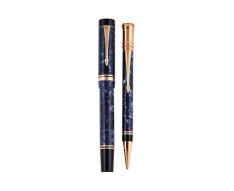 
	
		PARKER, DUOFOLD, CENTENNIAL 
		A BLUE MARBLED FOUNTAIN PEN AND PENCIL
		Cap and Barrel: With marbled blue resin caps and
