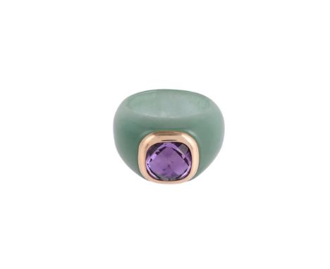 
	
		A JADE AND AMETHYST DRESS RING
		The facetted cushion shaped amethyst within a collet gold coloured setting, to a polish