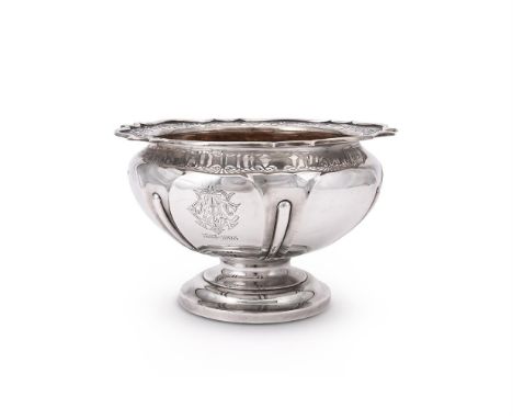 
	
		AN EDWARDIAN SILVER SHAPED CIRCULAR PEDESTAL BOWL
		ROBERTS &amp; BELK LTD., SHEFFIELD 1906
		The shaped border pierced 