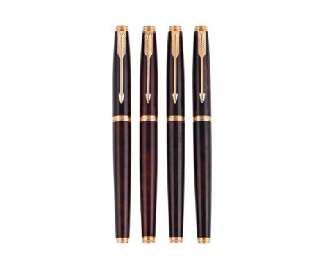 
	
		PARKER, 75 
		FOUR LAQUE FOUNTAIN PENS
		Cap and Barrel: With brown wood effect lacquered caps and barrels, arrow clips
