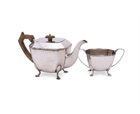 
	
		A SILVER OCTAGONAL TEA POT AND SUGAR BASIN
		STOWER &amp; WRAGG LTD., SHEFFIELD 1934
		The tea pot with a wooden finial 