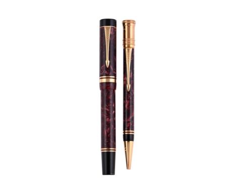
	
		PARKER, DUOFOLD CENTENNIAL 
		A RED MARBLED FOUNTAIN PEN AND BALL POINT PEN 
		Cap and Barrel: With red marbled resin ba