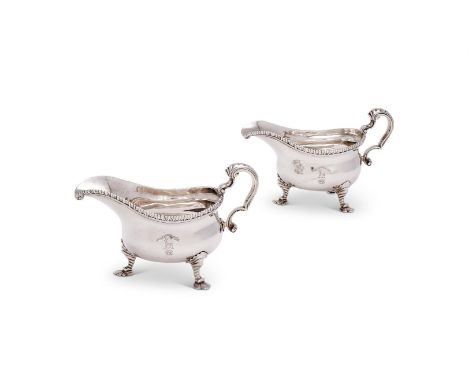 
	
		A PAIR OF GEORGE II SILVER OVAL SAUCE BOATS
		NO APPARENT MAKER'S MARKS, LONDON 1751
		With gadrooned borders, double sc