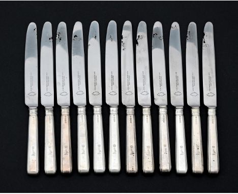 
	
		A SET OF TWELVE SILVER HANDLED TABLE KNIVES
		HARRISON BROTHERS &amp; HOWSON, SHEFFIELD 1938
		Engraved with a crest and