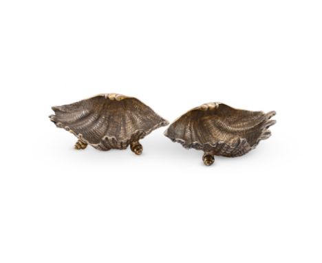 
	
		A PAIR OF SILVER GILT SHELL SHAPED SALTS
		WILLIAM COMYNS &amp; SONS LTD., LONDON 1969
		On three shell feet
		13cm (5in
