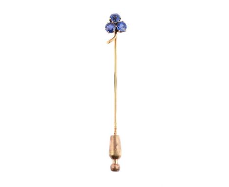 
	
		A SAPPHIRE CLOVER SHAPED STICK PIN
		The trio of circular cut sapphires in six claw settings, with gold coloured stalk, 