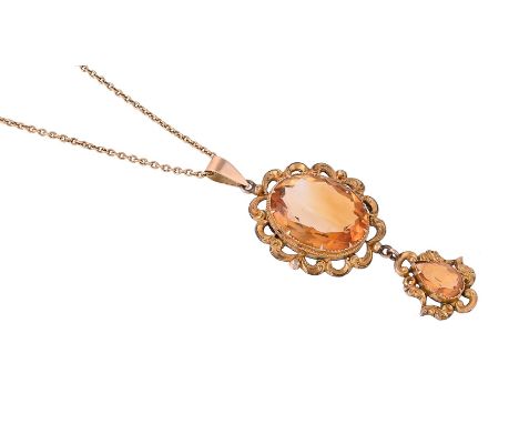 
	
		A CITRINE DROP PENDANT ON CHAIN
		The oval cut citrine within a scrolling gilt base metal setting, suspending a similarl