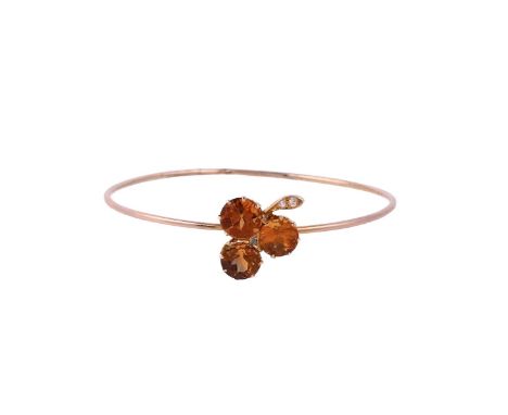 
	
		A LATE VICTORIAN CITRINE AND ROSE CUT DIAMOND CLOVER BANGLE
		The trio of circular cut citrines forming the clover, with