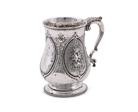 
	
		A VICTORIAN SILVER BALUSTER MUG
		AUGUSTUS GEORGE PIESSE, LONDON 1867
		With a leaf capped double scroll handle, the bod