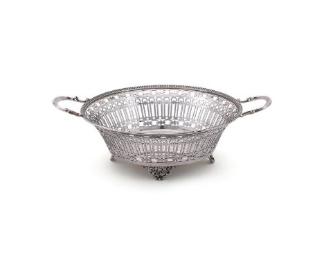 
	
		A SILVER CIRCULAR TWIN HANDLED BASKET
		WILLIAM HUTTON &amp; SONS LTD., SHEFFIELD 1917
		With twin loop handles, a nulle