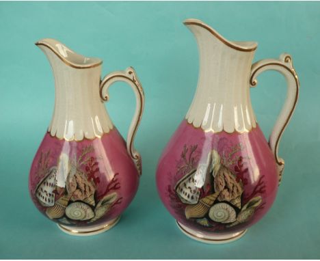 Two pear shaped jugs of varying size: Shells (52B) pink ground, gold line decoration, largest 295mm, restored (2) (potlid  po