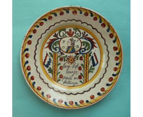 William V of Orange: a Dutch Delft plate painted in characteristic palette with a portrait initialled P V O R with a loyal in