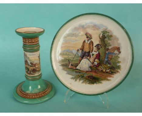 A squat candlestick: The Crooked Bridge (378) green ground, gold line decoration, 135mm and a teapot stand: Fair Sportswoman 