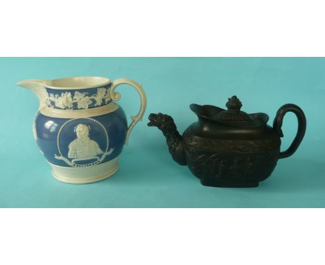 Wellington: a white stoneware jug banded in blue and moulded with named portraits of Wellington and Blucher, circa 1815, 151m