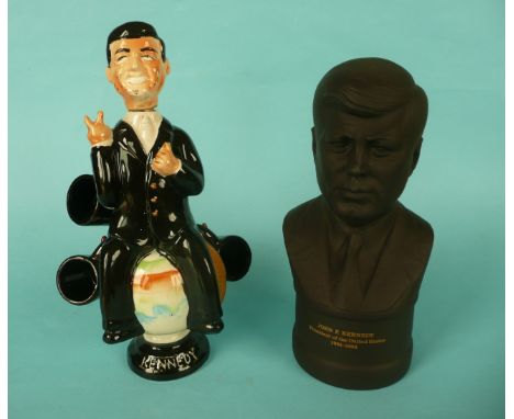 John Kennedy: an amusing pottery liquor set modelled as the President sat astride the globe, one of the four cups missing, 24