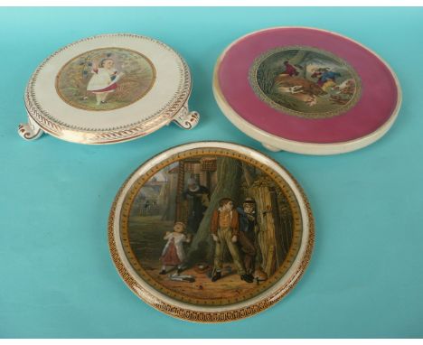 A teapot stand on integral scroll feet: Autumn (342) gilt decoration, another: The Boar Hunt (262) and one other (3) (potlid 