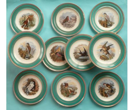 A dessert service comprising seven plates, one cracked, shallow comport, hairline crack and two tall comports:  Bird Subjects