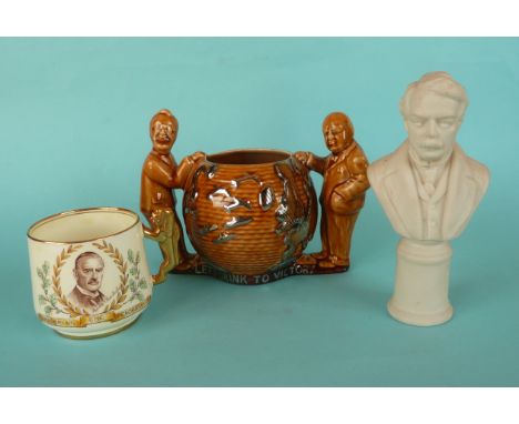 A small Paragon mug with gilt lion handle and named portrait of Chamberlain the Peacemaker, a pottery loving cup depicting Ch