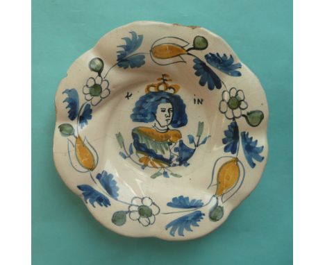 William and Mary: a Dutch Delft lobed dish of smaller size painted in blue, green and yellow with a crowned portrait, circa 1